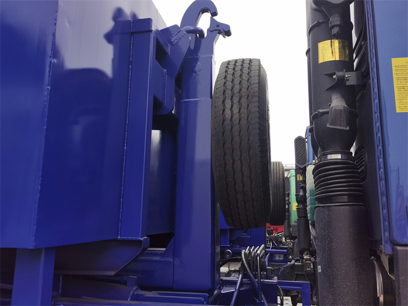 Hooklift truck with spare tire installed Hooklift truck with spare tire installed